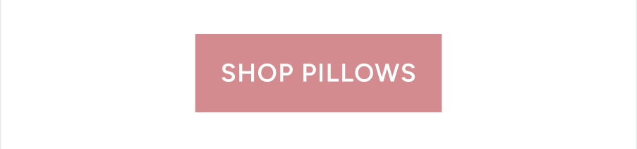 shop pillows pink button on white background